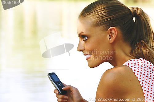 Image of a woman with mobile phone g
