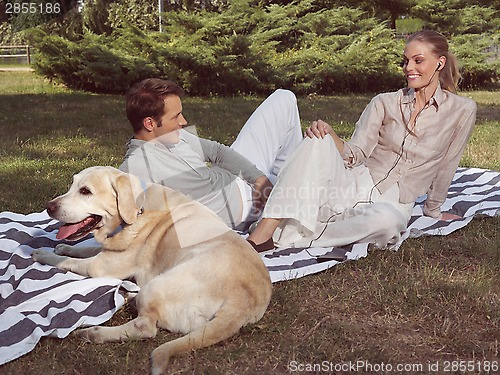 Image of couple with dog