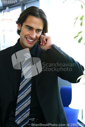 Image of young businessman at the office
