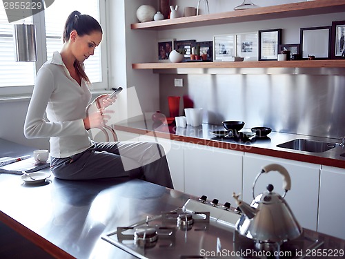 Image of middle woman in the kitchen