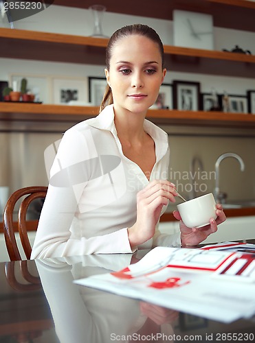 Image of successful woman in her home