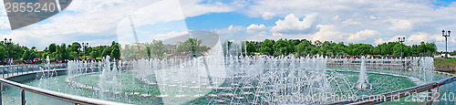 Image of Panorama beautiful fountain against the blue sky with clouds