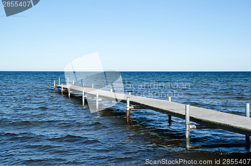 Image of Wooden bath pier in blue water