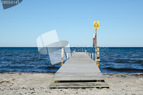 Image of Wooden bath pier with sign for shallow water