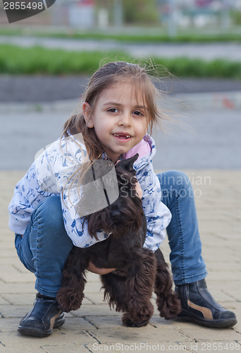 Image of Little girl with her dog