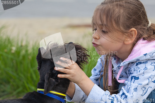 Image of Little girl and her dog