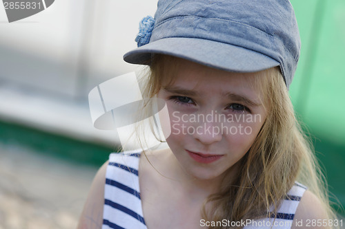 Image of Blonde young kid in denim cap