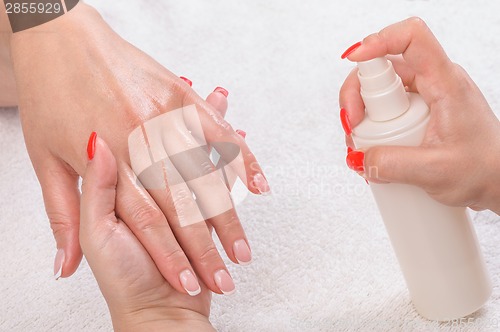 Image of manicure applying - moisturising