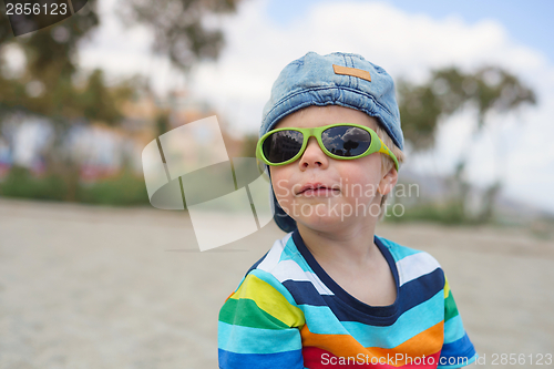 Image of Boy in denim hat and sunglasses