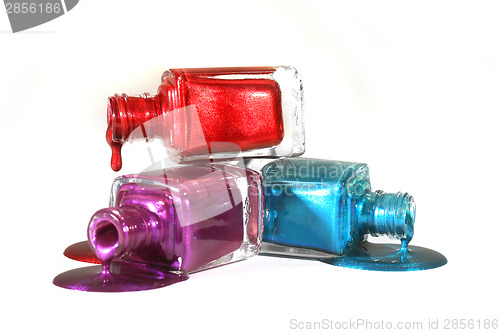 Image of Stacked Fingernail Polish of Red Blue and Purple