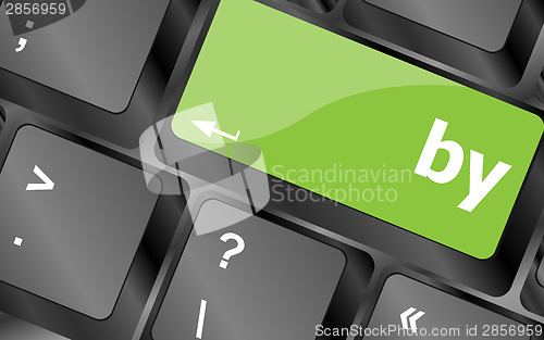 Image of by word on computer keyboard key