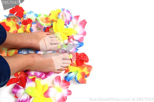 Image of woman legs (pedicure - colored nails)