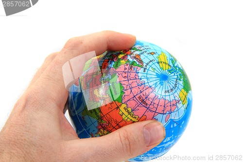 Image of world globe in human hand 