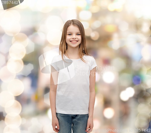 Image of smiling little girl in white blank t-shirt