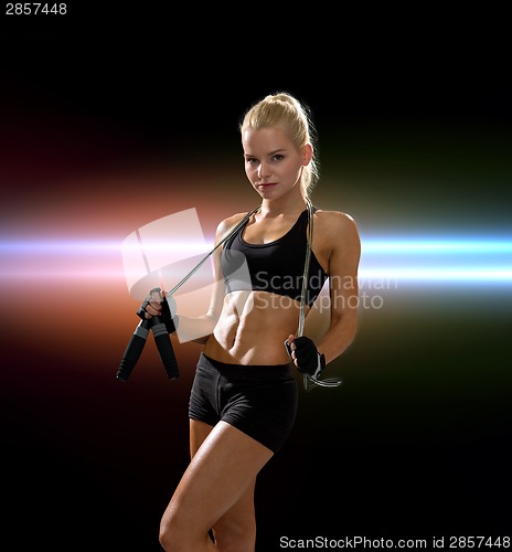 Image of sporty woman with skipping rope