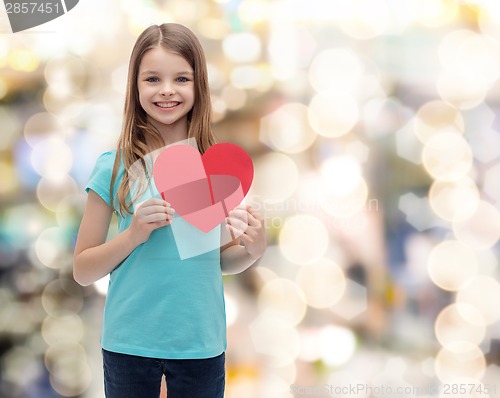Image of smiling little girl with red heart