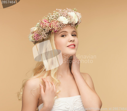 Image of woman wearing wreath of flowers