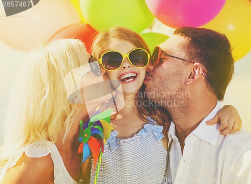 Image of family with colorful balloons