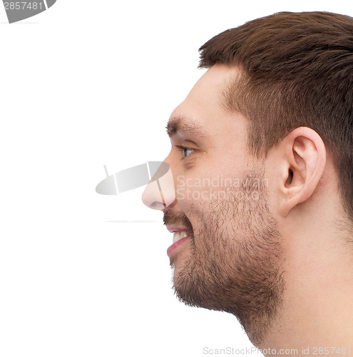 Image of profile portrait of smiling young handsome man