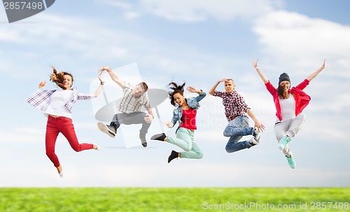 Image of group of teenagers jumping