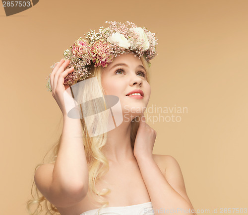 Image of woman wearing wreath of flowers