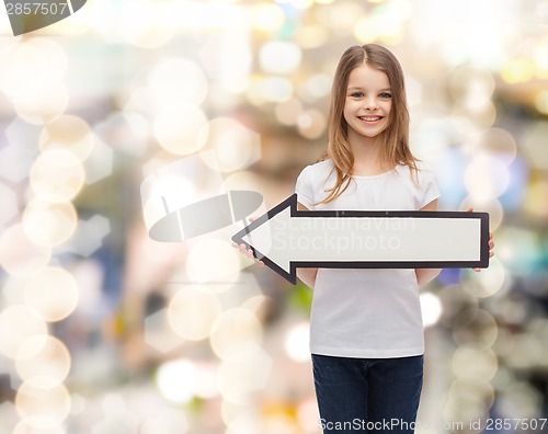 Image of smiling girl with blank arrow pointing left