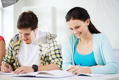 Image of students with textbooks and books at school