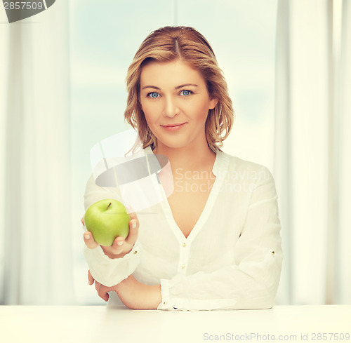 Image of woman with green apple