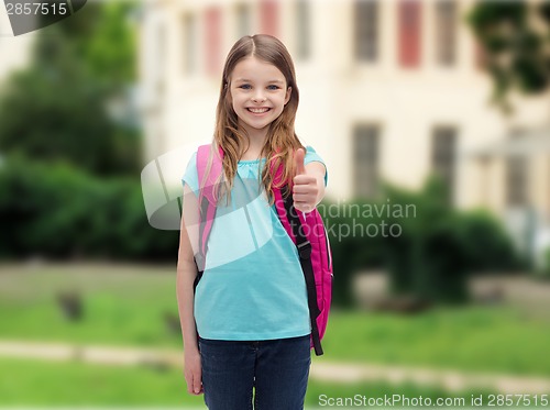 Image of smiling girl with school bag showing thumbs up