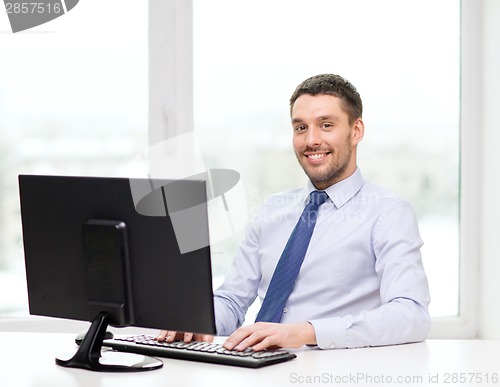 Image of smiling businessman or student with computer