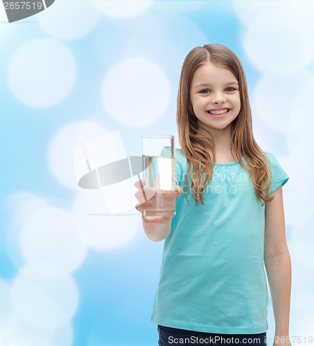 Image of smiling little girl giving glass of water