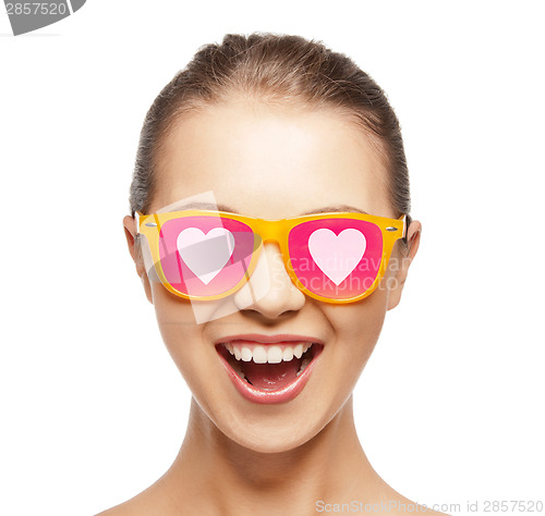 Image of happy teenage girl in shades with hearts