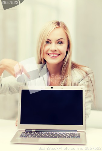 Image of businesswoman with laptop computer