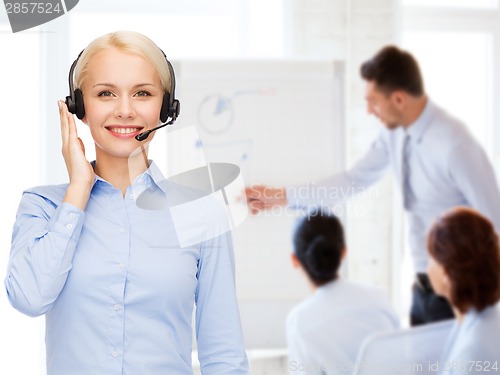 Image of friendly female helpline operator