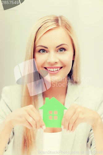 Image of woman with illustration of eco house