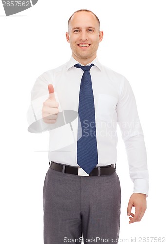Image of smiling businessman showing thumbs up