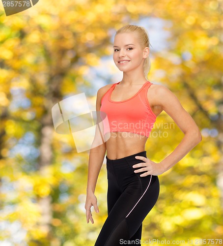 Image of beautiful athletic woman in sportswear