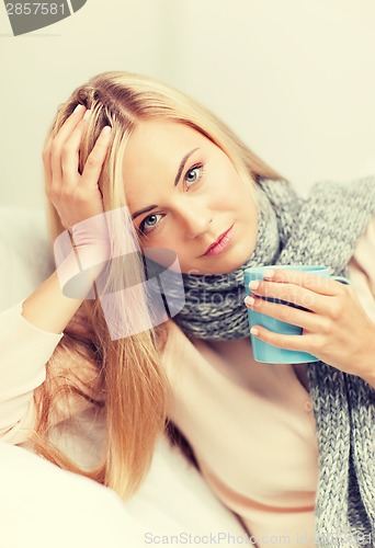 Image of diseased woman with cup of tea