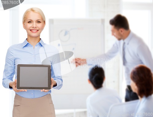 Image of businesswoman with blank black tablet pc screen