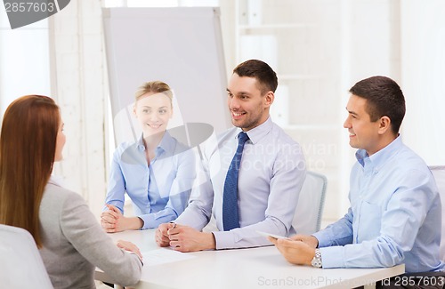 Image of business team interviewing applicant in office