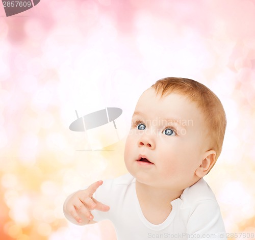 Image of curious baby looking up