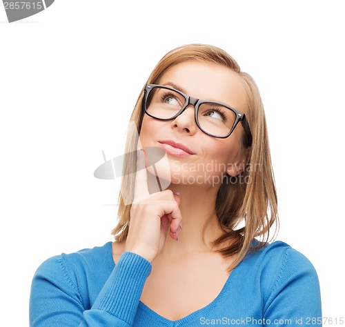 Image of happy woman in black eyeglasses dreaming