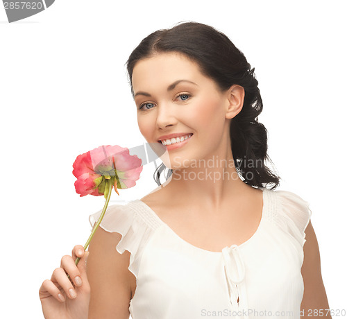 Image of young and beautiful woman with flower