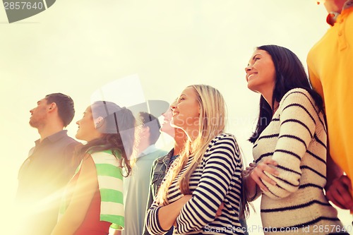 Image of group of friends having fun on the beach