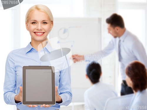 Image of businesswoman with blank black tablet pc screen