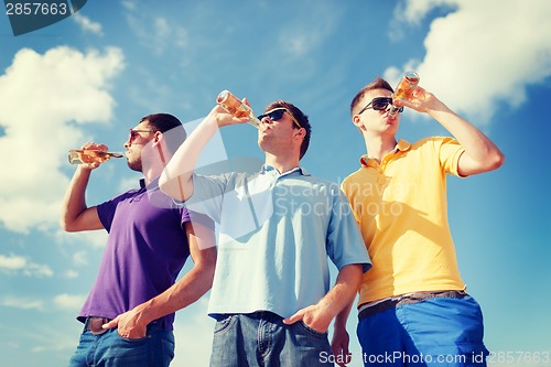 Image of group of male friends with bottles of beer