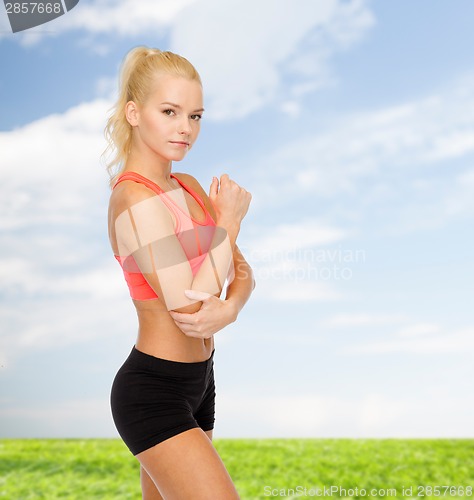 Image of sporty woman with pain in elbow