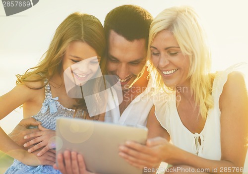 Image of happy family with tablet pc taking picture