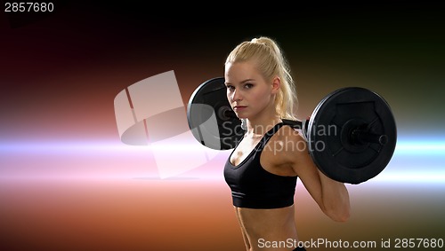 Image of sporty woman exercising with barbell