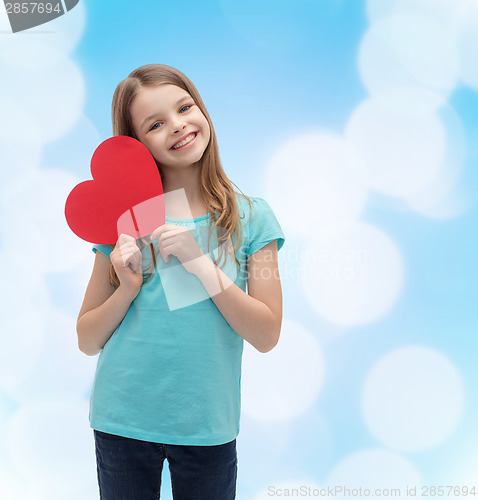 Image of smiling little girl with red heart